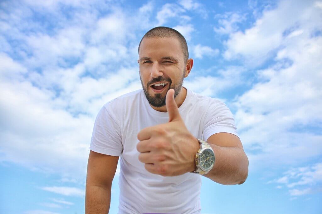 man with high testosterone and thumbs up